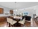 Open-concept kitchen and living room with hardwood floors and stainless steel appliances, great for entertaining at 5041 Wakehurst St, Kannapolis, NC 28081