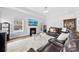 Comfortable living room with fireplace and a large television, great for relaxing and entertaining at 5041 Wakehurst St, Kannapolis, NC 28081