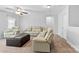 Spacious living room with comfortable seating, ceiling fan, and neutral decor at 5041 Wakehurst St, Kannapolis, NC 28081