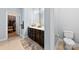 Main bathroom featuring double sinks, vanity, and walk-in closet at 5041 Wakehurst St, Kannapolis, NC 28081