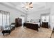 Main bedroom featuring tray ceiling, ceiling fan, and matching dressers at 5041 Wakehurst St, Kannapolis, NC 28081