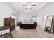 Main bedroom featuring tray ceiling, ceiling fan, and matching dressers at 5041 Wakehurst St, Kannapolis, NC 28081