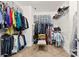 Organized walk-in closet with shelves, hanging rods, and storage bins for clothing and accessories at 5041 Wakehurst St, Kannapolis, NC 28081