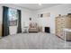 Comfortable bedroom featuring neutral carpet, a rocking chair, and a decorative dresser at 518 Palmarosa St, Fort Mill, SC 29715