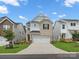 Beautiful two-story home with brick and siding, featuring a two-car garage and well-kept lawn at 518 Palmarosa St, Fort Mill, SC 29715