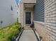 Welcoming front entrance with a charming walkway, beautiful landscaping, and a classic black front door at 518 Palmarosa St, Fort Mill, SC 29715
