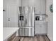 Modern kitchen features a stainless steel refrigerator and gray cabinets at 518 Palmarosa St, Fort Mill, SC 29715