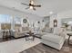 A spacious living room features a large sectional sofa, natural light, and stylish decor at 518 Palmarosa St, Fort Mill, SC 29715