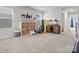 Spacious playroom features neutral carpet, shelving, and plenty of room to play at 518 Palmarosa St, Fort Mill, SC 29715