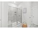Bright bathroom showing a glass shower with built in shelves and tiled walls at 5367 Turtle Creek Dr, Denver, NC 28037