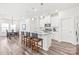Bright kitchen with a center island, white cabinetry, and stainless steel appliances at 5367 Turtle Creek Dr, Denver, NC 28037