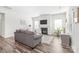 Bright living room with a fireplace, comfortable seating, and hardwood floors at 5367 Turtle Creek Dr, Denver, NC 28037