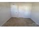 Bedroom with two white doors and neutral carpet at 609 Grandiflora Ave, Lancaster, SC 29720