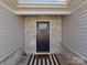 Entryway with a dark door and stone accents at 609 Grandiflora Ave, Lancaster, SC 29720