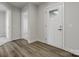 Bright entryway with hard surface floors, a white front door, and neutral wall colors at 609 Grandiflora Ave, Lancaster, SC 29720