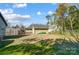 Expansive backyard with a detached garage, offering ample space for outdoor activities and potential gardening at 6618 Alexander Rd, Charlotte, NC 28270