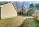 Spacious grassy backyard offers a peaceful retreat with room for recreation and relaxation, surrounded by trees at 6618 Alexander Rd, Charlotte, NC 28270