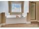 Bathroom featuring a garden tub and separate shower with glass door at 6618 Alexander Rd, Charlotte, NC 28270