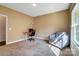 Home office featuring a neutral color scheme with a gray chair, modern desk, and bright natural light at 6618 Alexander Rd, Charlotte, NC 28270