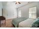 Bright bedroom featuring tray ceilings, a ceiling fan, and carpet floors at 6618 Alexander Rd, Charlotte, NC 28270