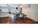 Dining area with hardwood floors and seating that opens to the living room at 6618 Alexander Rd, Charlotte, NC 28270