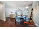 Dining area with hardwood floors that opens to the living room at 6618 Alexander Rd, Charlotte, NC 28270