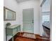 Welcoming foyer with hardwood floors, a decorative table, and a stylish mirror at 6618 Alexander Rd, Charlotte, NC 28270