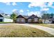 Charming single-story brick home with a well-manicured lawn and a long driveway at 6618 Alexander Rd, Charlotte, NC 28270