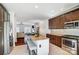 A kitchen featuring stainless steel appliances, granite countertops, and a center island with seating at 6618 Alexander Rd, Charlotte, NC 28270