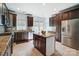 Updated kitchen featuring stainless steel appliances, granite countertops, and a center island at 6618 Alexander Rd, Charlotte, NC 28270