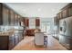 Updated kitchen featuring stainless steel appliances, granite countertops, and a center island with seating at 6618 Alexander Rd, Charlotte, NC 28270