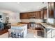 Updated kitchen featuring stainless steel appliances, granite countertops, and a center island with seating at 6618 Alexander Rd, Charlotte, NC 28270