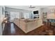Spacious living room featuring hardwood floors, a fireplace, and large windows at 6618 Alexander Rd, Charlotte, NC 28270