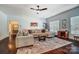 Inviting living room with a cozy sectional sofa, area rug, and plenty of natural light at 6618 Alexander Rd, Charlotte, NC 28270