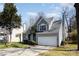Charming two-story home featuring a well-maintained lawn, two car garage, and mature trees at 7533 Lady Bank Dr, Charlotte, NC 28269