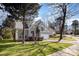 Charming two-story home featuring a well-maintained lawn and mature trees at 7533 Lady Bank Dr, Charlotte, NC 28269