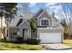 Charming two-story home with well-manicured lawn, two car garage, and inviting curb appeal at 7533 Lady Bank Dr, Charlotte, NC 28269