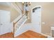 Bright foyer with staircase, hardwood floors, and natural light at 7533 Lady Bank Dr, Charlotte, NC 28269
