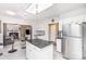 Kitchen with stainless steel appliances, island, and open layout to the living room at 7533 Lady Bank Dr, Charlotte, NC 28269