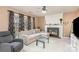 Cozy living room featuring a fireplace, comfortable seating, and natural light at 7533 Lady Bank Dr, Charlotte, NC 28269
