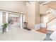 Spacious living room featuring large windows, a staircase, and a neutral color palette at 7533 Lady Bank Dr, Charlotte, NC 28269