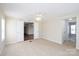 Bright bedroom with neutral carpet, ceiling fan and open double doors to another room at 7536 Beaver Rd, Kannapolis, NC 28081