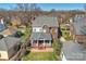 Charming two-story brick home featuring a covered front porch, lush lawn and a well-maintained yard at 7704 Sharpthorne Pl, Charlotte, NC 28270
