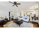 Open concept living room with comfortable seating, and seamless access to the kitchen and dining areas at 7704 Sharpthorne Pl, Charlotte, NC 28270