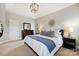 The primary bedroom features a tray ceiling, carpet, ample closet space, and lots of natural light at 7704 Sharpthorne Pl, Charlotte, NC 28270