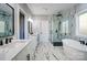 Luxurious bathroom with marble-style tiles, dual vanity sinks, a glass shower, and a freestanding tub at 805 Tirzah Rd, York, SC 29745