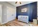 Charming Bedroom featuring a wood accent wall, ample closet space, and neutral color palette at 805 Tirzah Rd, York, SC 29745