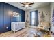 Cozy Bedroom with a wood accent wall, plush rug, and comfortable rocking chair at 805 Tirzah Rd, York, SC 29745