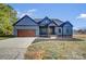 Charming one story home with a two car garage, craftsman style accents, and concrete driveway at 805 Tirzah Rd, York, SC 29745