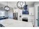 Kitchen area featuring quartz countertops, stainless steel appliances, and elegant pendant lighting at 805 Tirzah Rd, York, SC 29745